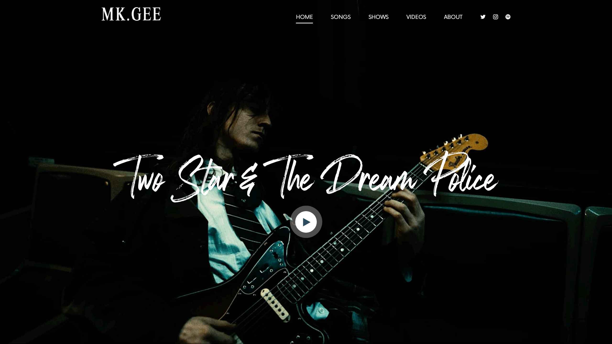 A website landing page showing artist Mk.gee playing his guitar